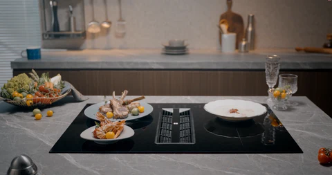 Qu'est-ce qu'une table de cuisson aspirante intégrée?